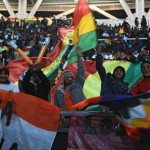 Supporters of Bolivia cheer for their na