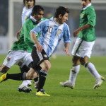 Argentine forward Lionel Messi (R) vies