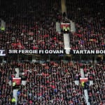 Manchester United fans display a banner