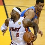 LeBron James (L) of the Miami Heat is gu