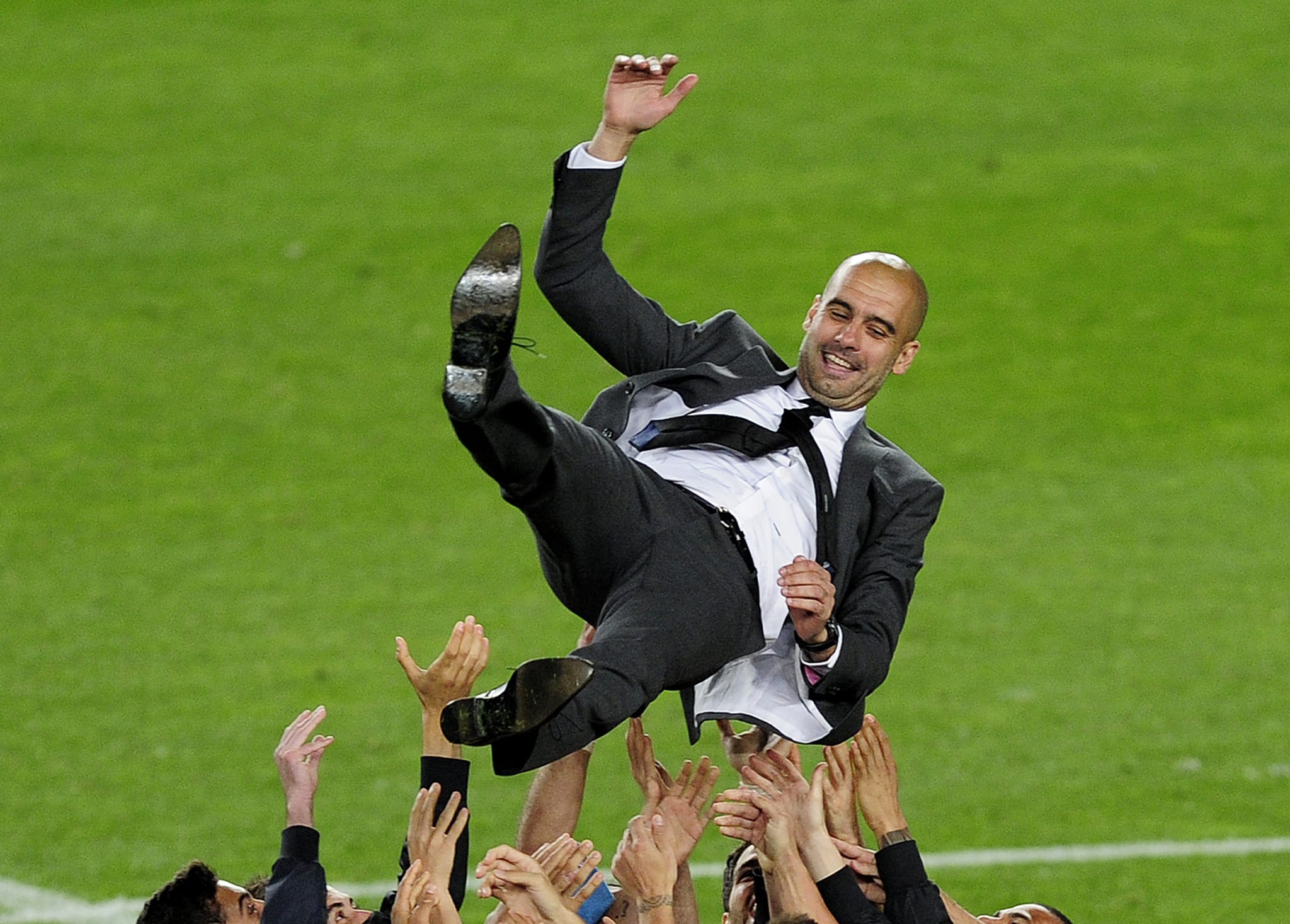 Barcelona's players throu to the air to